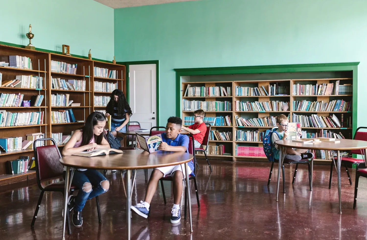 Children reading and learning together in a community library