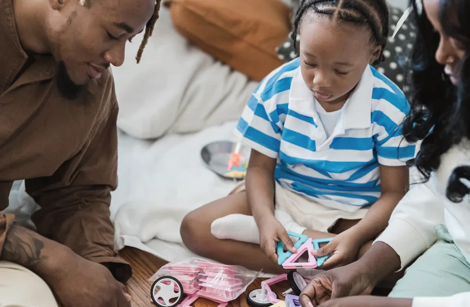 Parents and a child sharing a hands-on activity