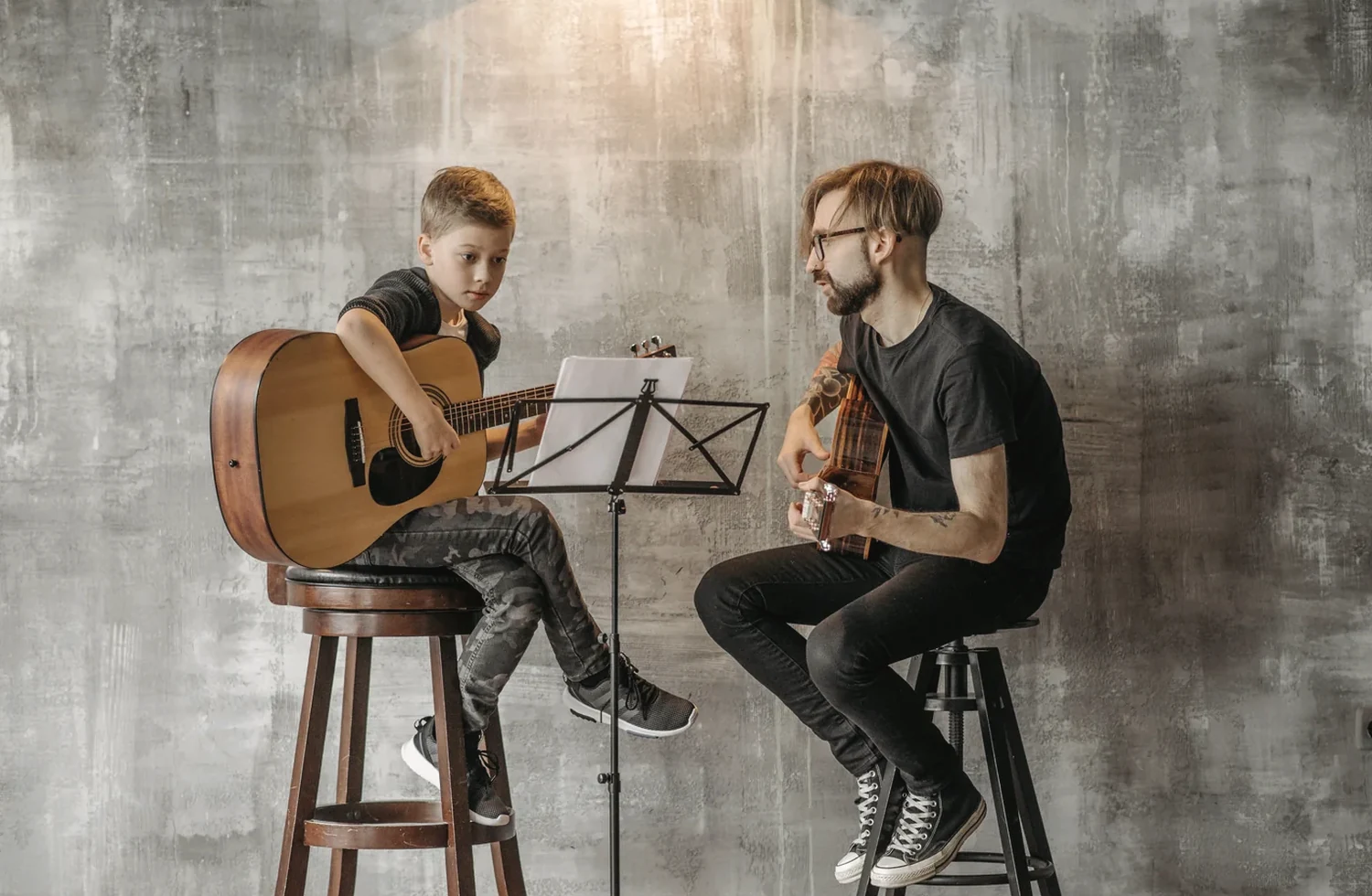 A child and adult sharing a music activity